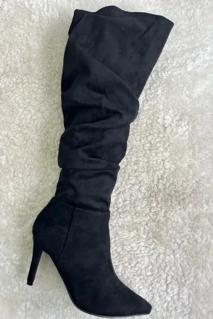 Black pointed-toe heeled suedette boots